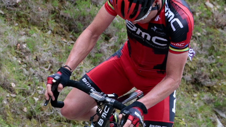 Tour de France 2011 winner, Australia's Cadel Evans starts riding after he had a flat tyre.