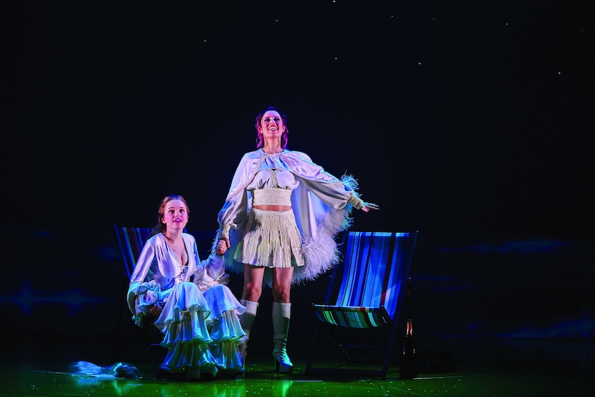 Two women in ABBA costumes on stage for Muriel's Wedding the musical