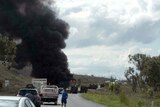 Fire and smoke billow from a truck after a crash north of Bajool in central Queensland. September 29