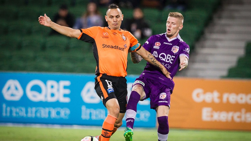 The Roar's Jade North (L) challenges the Glory's Andy Keogh for possession.