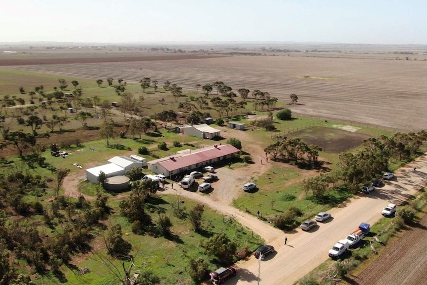 An aerial photos of a house on a rural property