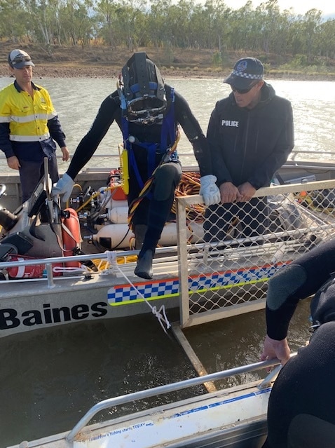 A police divers stepped into a cage