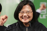 Taiwanese President Tsai Ing-wen clutches her fist as a sign of victory.