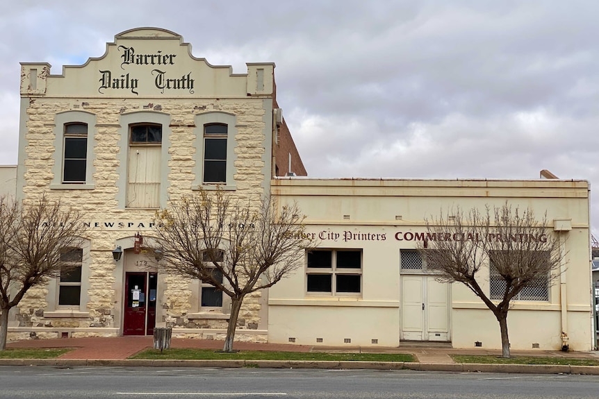 Exterior shot of an older style heritage building with the cursive words 'Barrier Daily Truth' written on the front of building.
