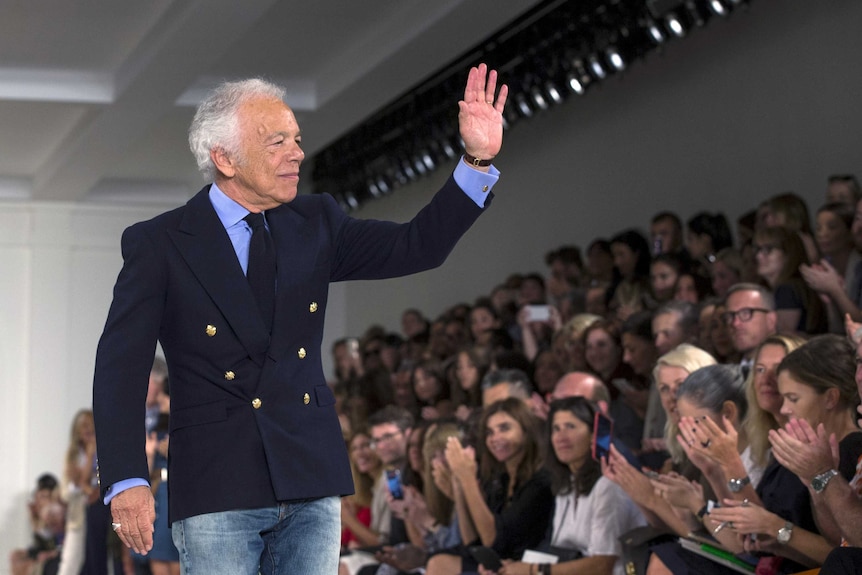 Fashion designer Ralph Lauren greets the crowd at New York Fashion Week.