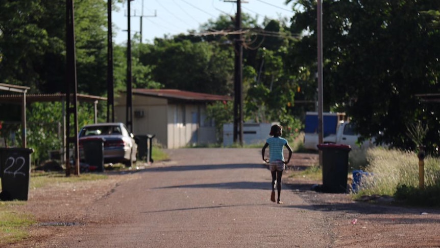 Child walks the streets at Wallaby beach, Nhulunbuy, Northern Territory