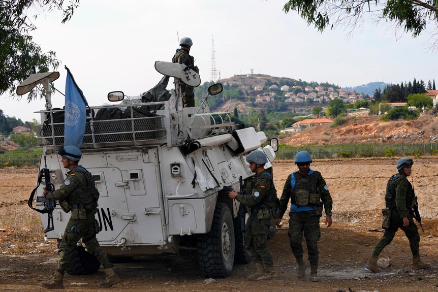 UN peacekeepers patrol on the Lebanese side of the Lebanese-Israeli border.