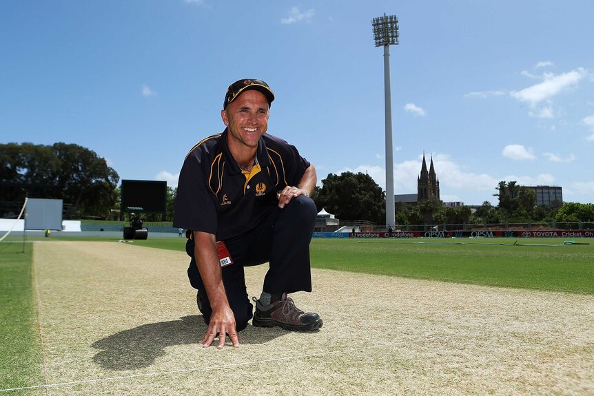 Batting wicket ... Adelaide Oval curator Damian Hough inspecting the pitch yesterday.