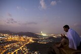 A Muslim pilgrim prays on Noor Mountain in the holy city of Mecca
