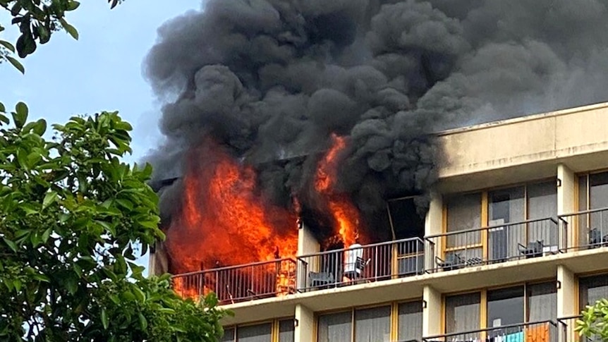 Fire burns in two rooms on the top floor of a hotel