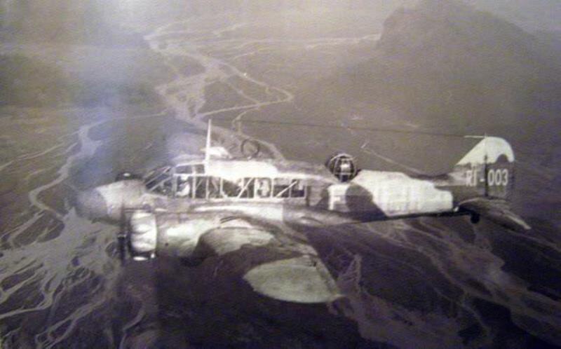 Black and white photograph of an old avro-anson airplane. 