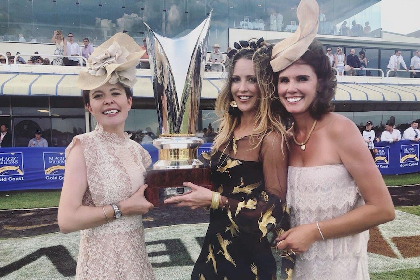 Hannah Wall, Melissa Margolis and Katie Thompson (from left to right) pictured with Magic Millions trophy.