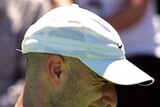 Andre Agassi grimaces after being injured at Kooyong Classic