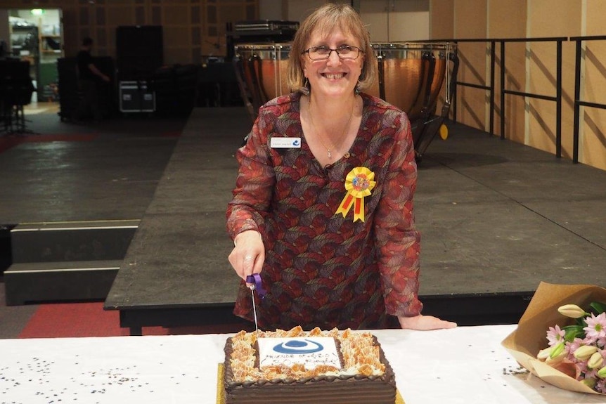 Alison cutting cake