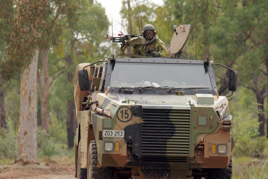 Army reserves in Bush Master vehicle practicing an 'ambush convoy