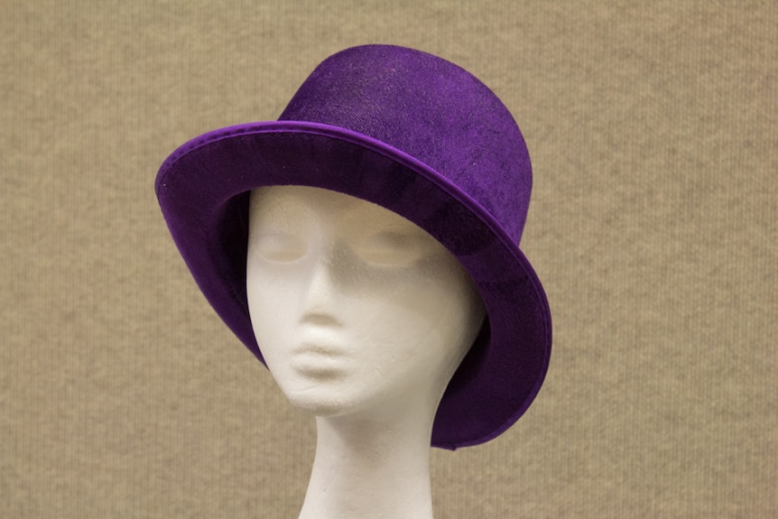 Purple felt top hat.