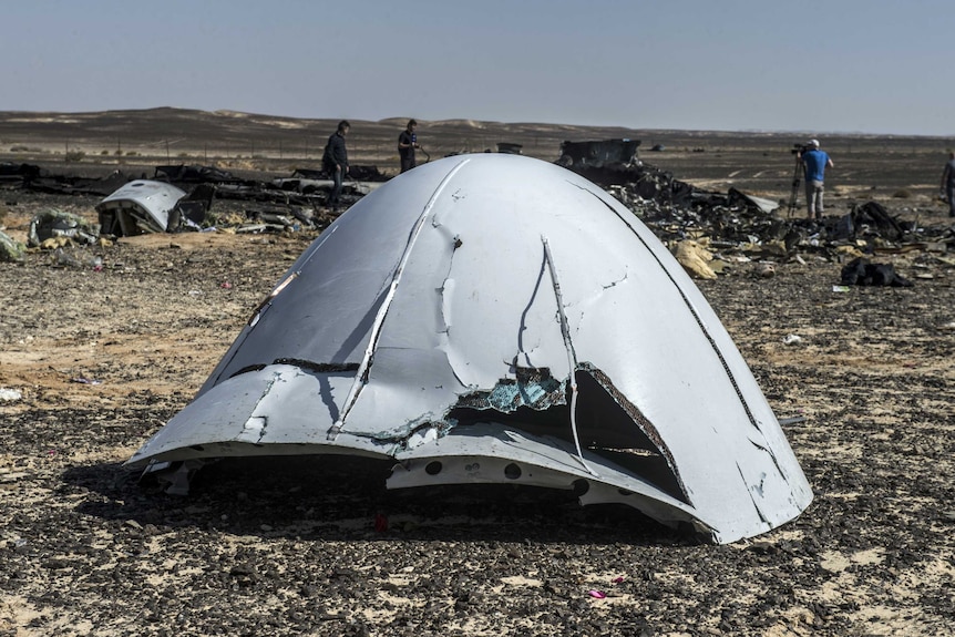 Debris of the A321 Russian airliner lie on the ground