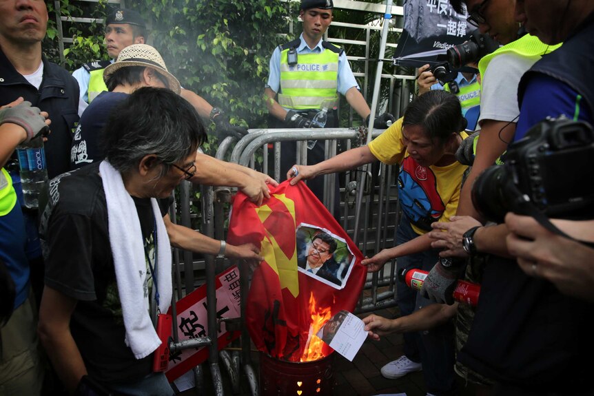 Protesters burn Chinese flag