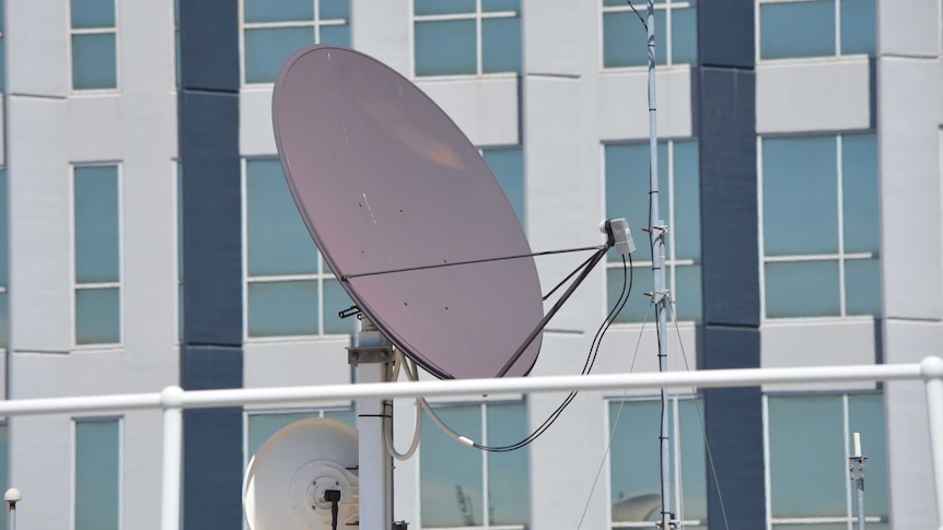 A broadband satellite mounted on a building.