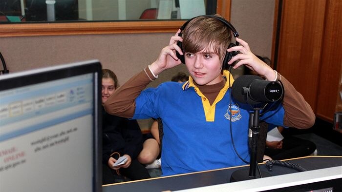 A student in the recording studio recording names of soldiers for a Centenary project.