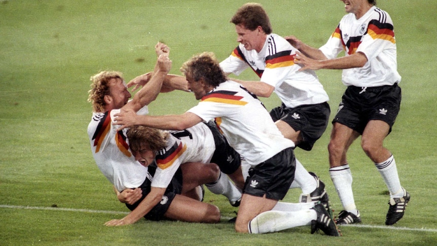 Brehme mobbed after scoring winner in 1990 World Cup final