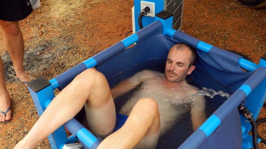 Dave Alley takes an ice bath during his Race Around Australia record attempt.