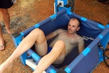 Dave Alley takes an ice bath during his Race Around Australia record attempt.