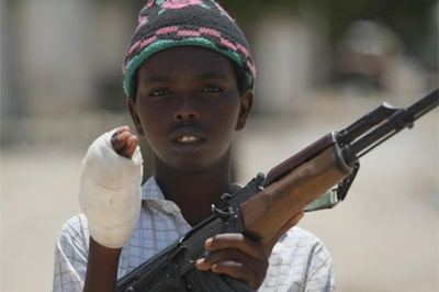 A young fighter from the Al-Shabab militia, wounded while battling Somali government forces in Mogadishu last month
