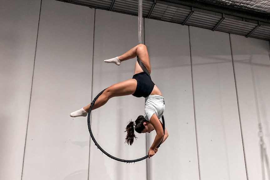 Angela in a pose while doing aerial silks, for a story about the benefits of hobbies.