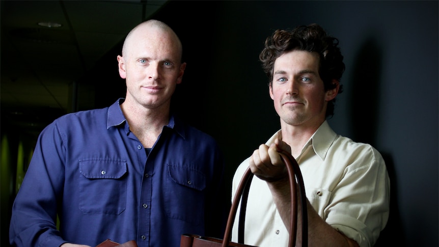 Joram Salisbury and Cameron Paterson hold their leather goods.