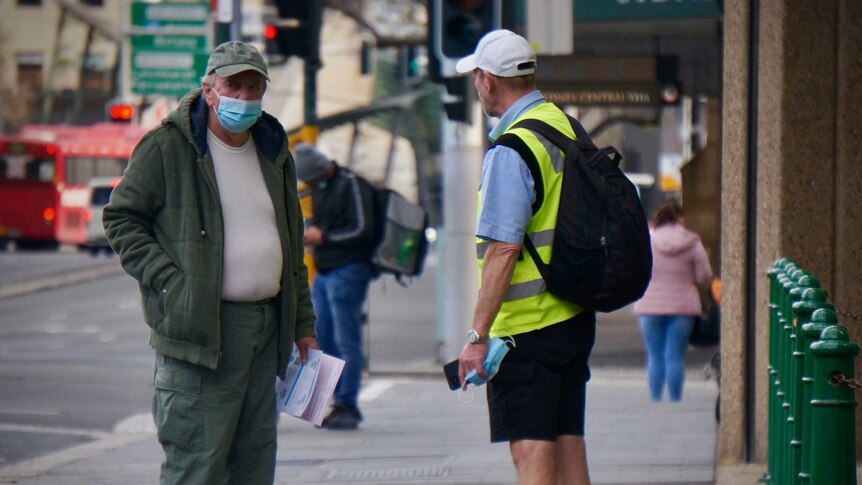 Two men wearing masks in Sydney during lockdown