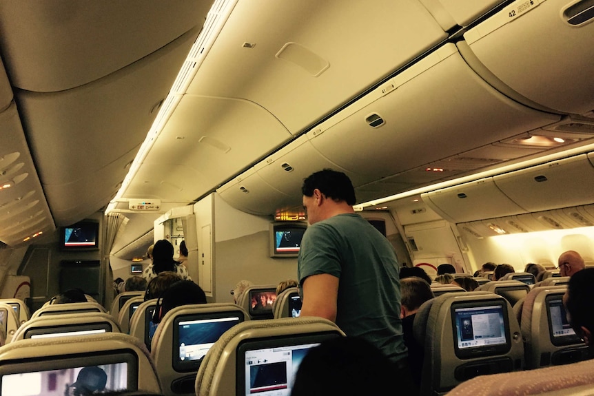 Passengers on board an Emirates flight from Sydney to Bangkok