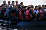 Syrian refugees arrive on a dinghy at the Greek island of Kos