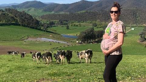Laura Hogg standing in a paddock at her Biggara property while she was pregnant with Audrey before the fires.