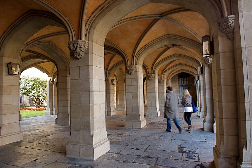 People walking through Melbourne University cloisters