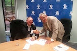 East Gippsland Shire councillor Ben Buckley signs declaration to abide by code of conduct pictured with CEO Gary Gaffney