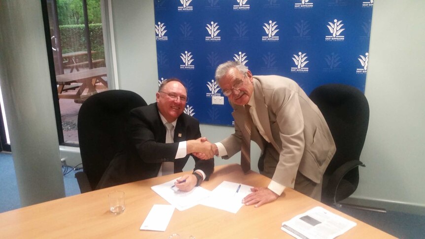 East Gippsland Shire councillor Ben Buckley signs declaration to abide by code of conduct pictured with CEO Gary Gaffney