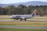 A Jetstar plane arrives at Hobart Airport