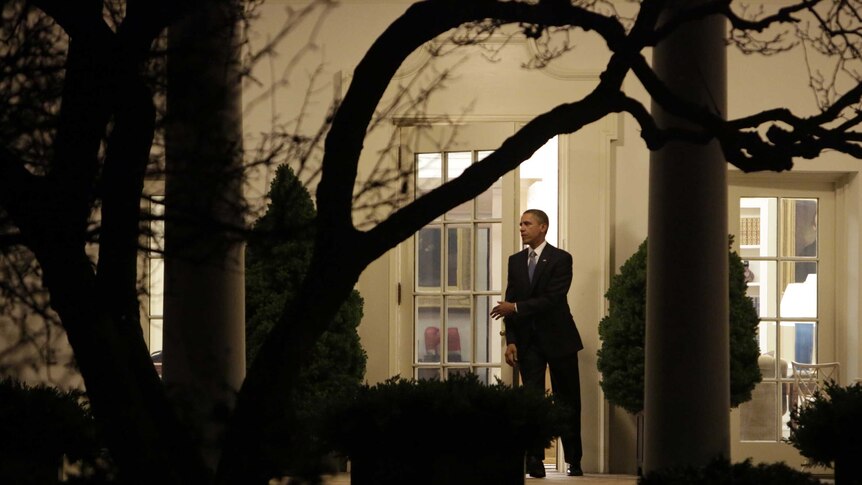 US president Barack Obama departs the White House after delivering a statement.