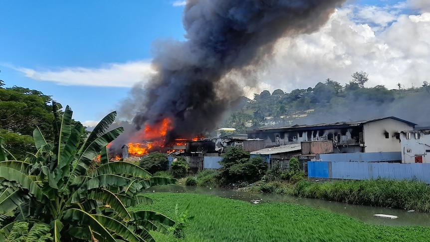 Flames rise from buildings in Honiara's Chinatown 