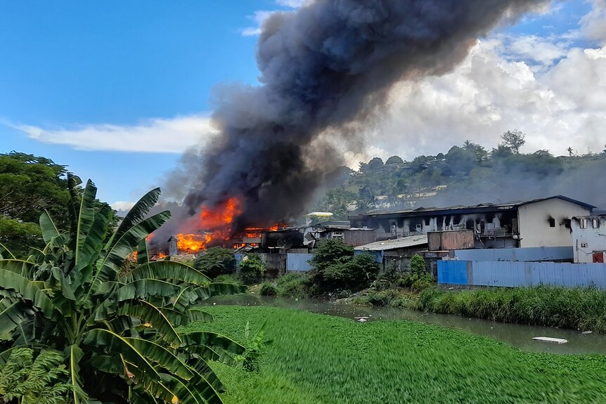 Flames rise from buildings in Honiara's Chinatown 