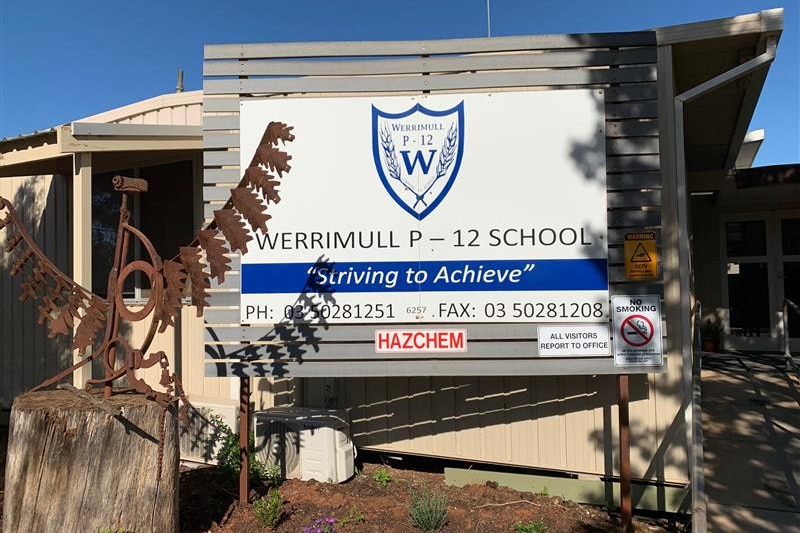Sign at front of Werrimull P-12 school reading "Striving to Achieve"