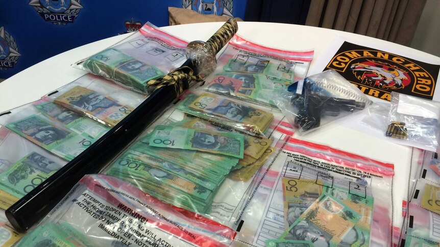 Cash, guns and a sword seized in raids