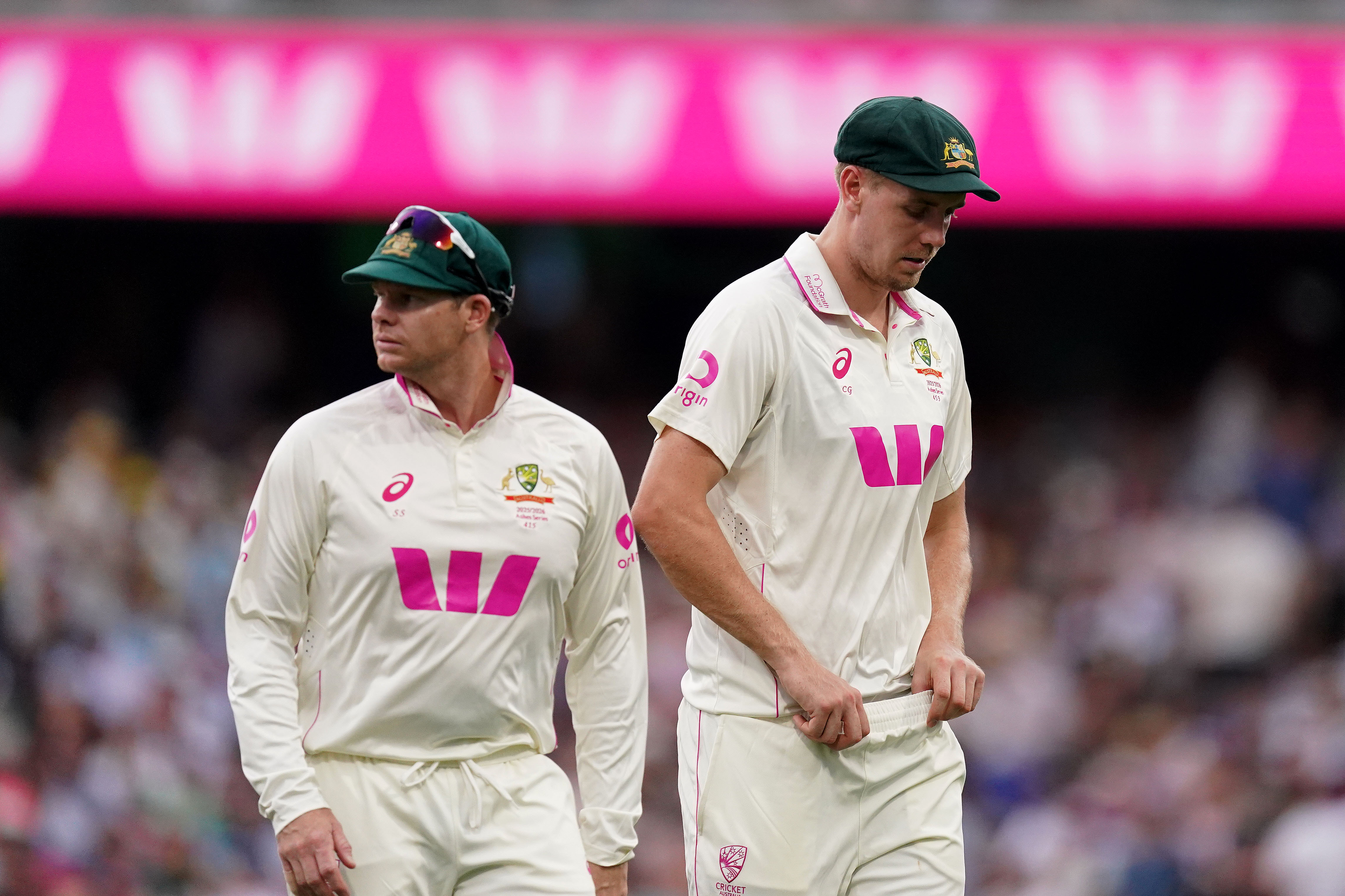 Steve Smith and Cameron Green look a little downcast while leaving the field at the SCG