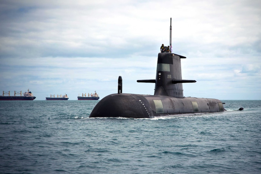 A submarine floats in open water.