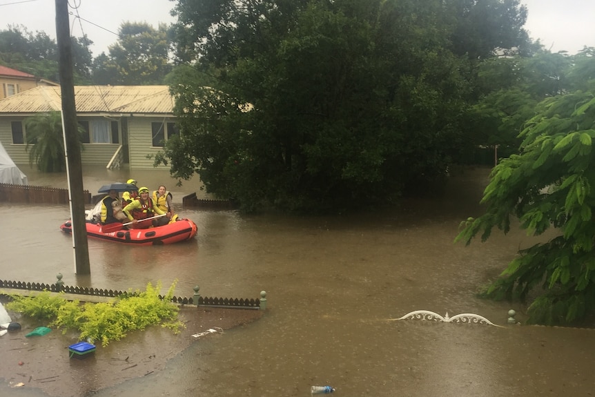 Rescue boat in muddy flood waters.