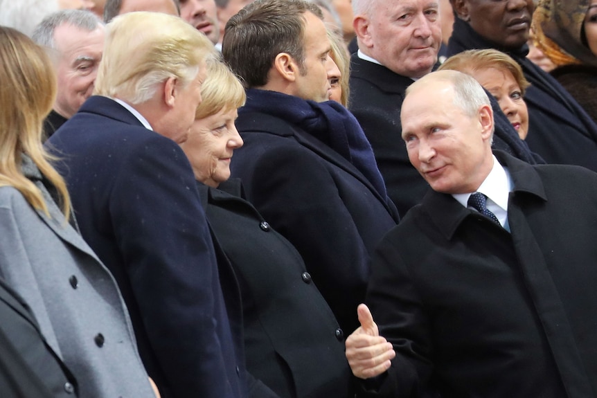 Russian President Vladimir Putin gives Donald Trump a thumbs up