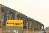 For Sale signs outside new townhouses at Gungahlin in Canberra's north.