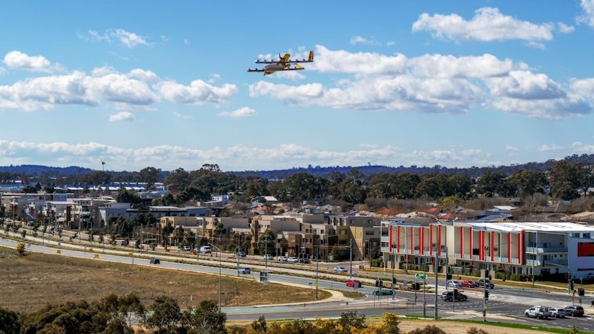 A drone flies high above a Canberra suburb.