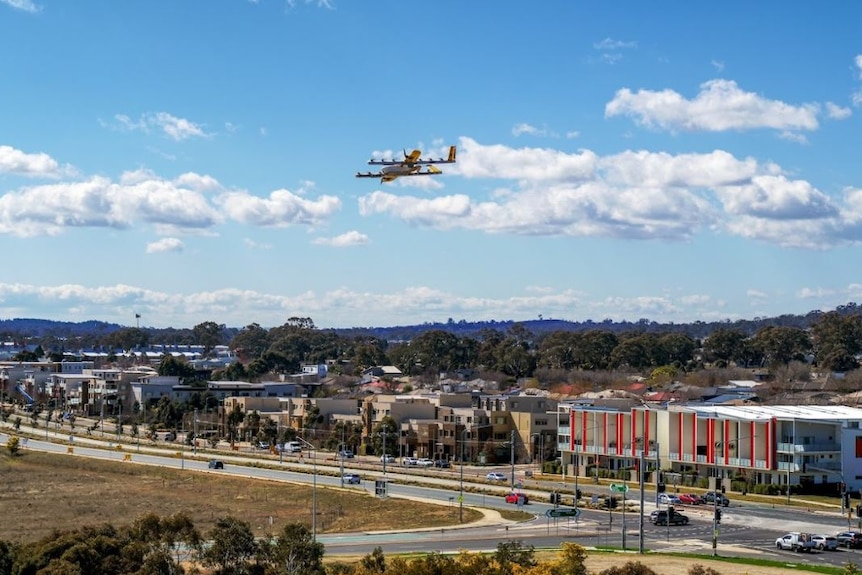 A drone flies high over a suburb of Canberra.